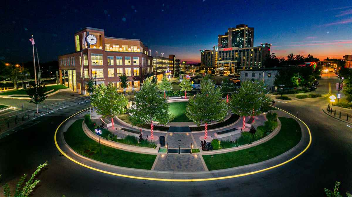 Night skyline with clock tower and circle park